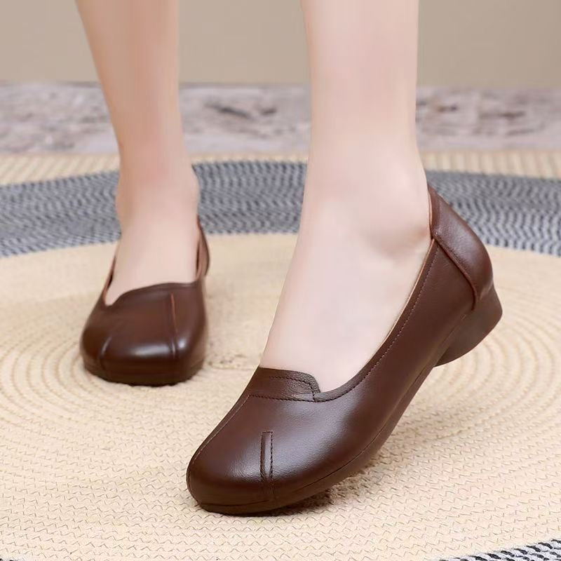 Zapatos cómodos de cuero con suela blanda y punta redonda