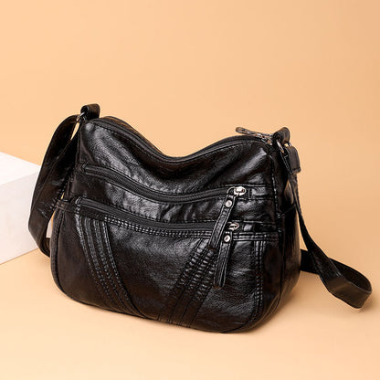 Bolso bandolera multibolsillos de piel suave