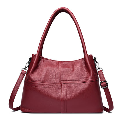 Bolso de mano de piel suave con textura de patchwork para mujer.