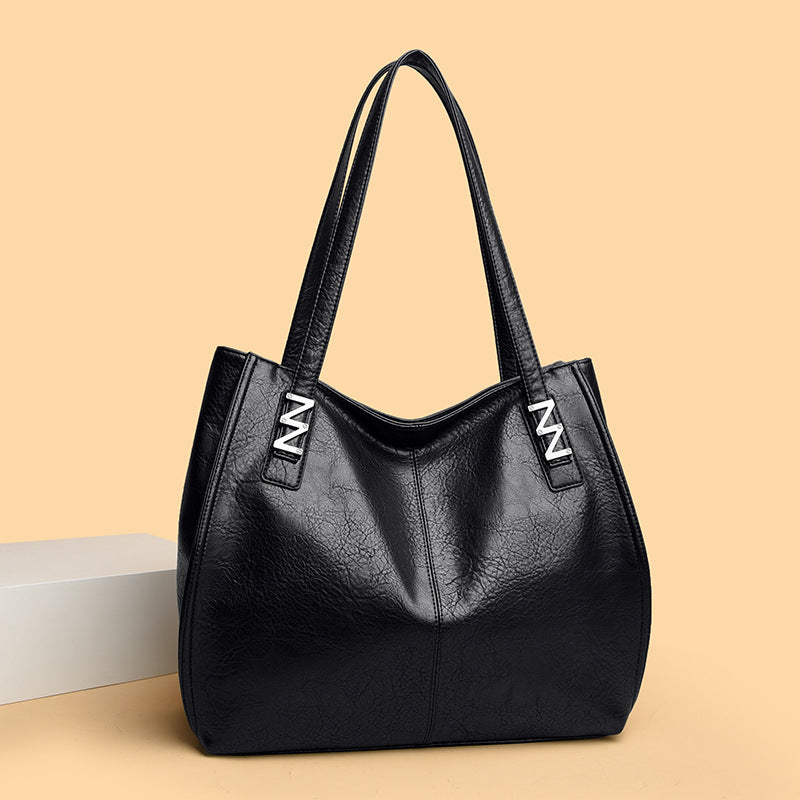 Bolso de mano retro-chic, de lujo sutil y gran capacidad.