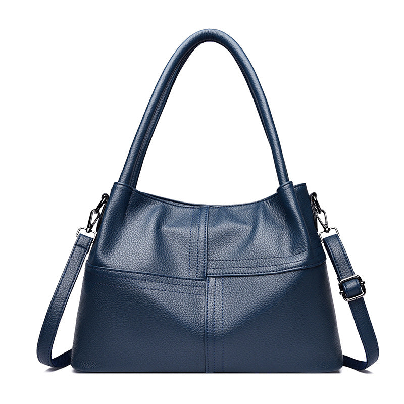 Bolso de mano de piel suave con textura de patchwork para mujer.