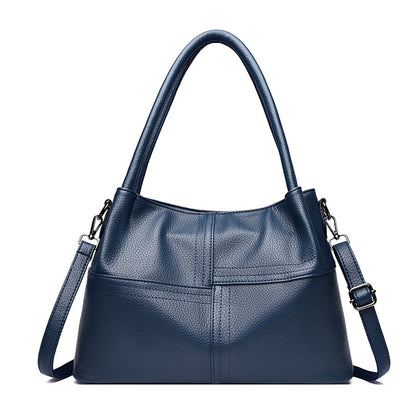 Bolso de mano de piel suave con textura de patchwork para mujer.