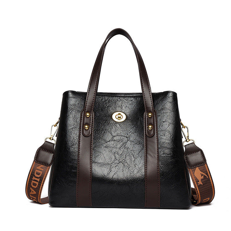 Bolso de mano de cuero suave bicolor
