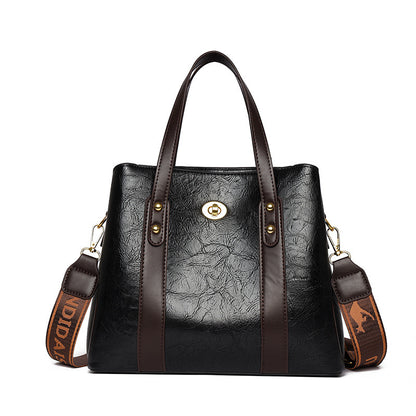 Bolso de mano de cuero suave bicolor