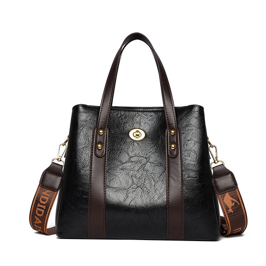Bolso de mano de cuero suave bicolor