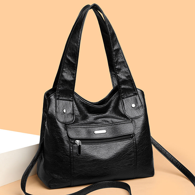 Bolso de cuero de gran capacidad y banda ancha