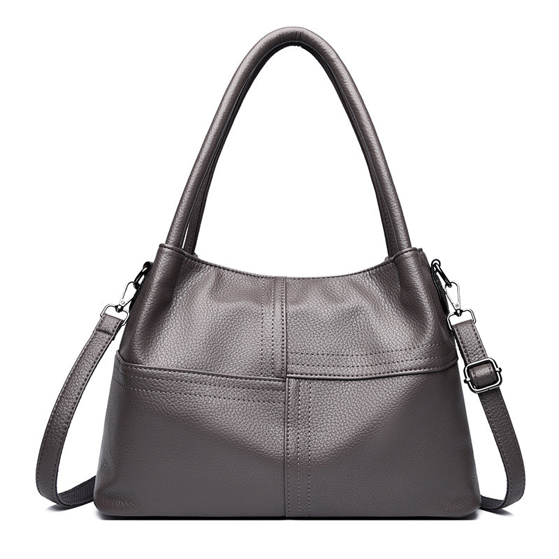 Bolso de mano de piel suave con textura de patchwork para mujer.
