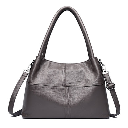 Bolso de mano de piel suave con textura de patchwork para mujer.