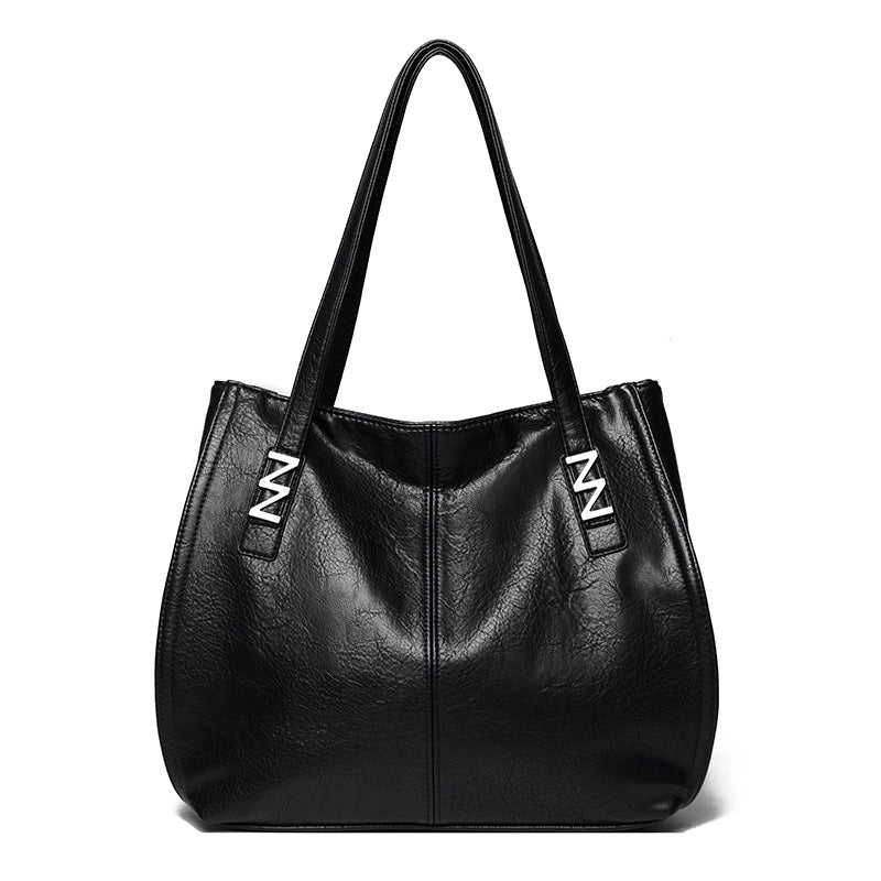 Bolso de mano retro-chic, de lujo sutil y gran capacidad.