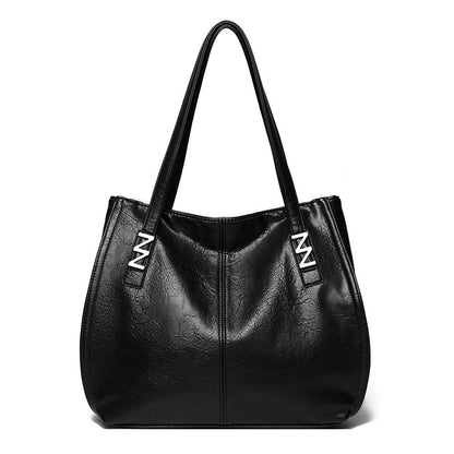 Bolso de mano retro-chic, de lujo sutil y gran capacidad.