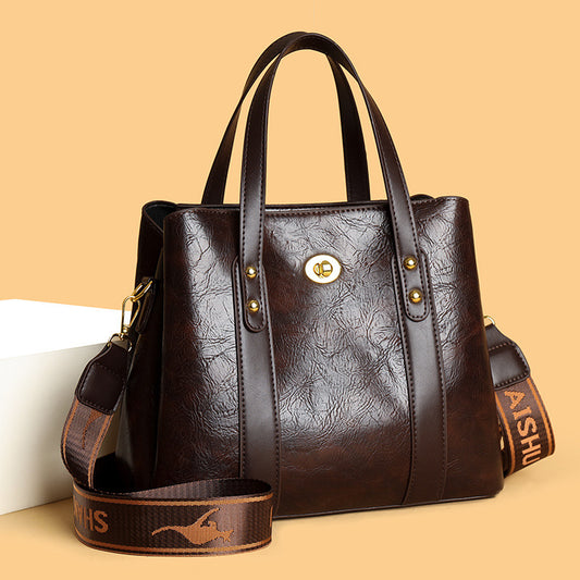 Bolso de mano de cuero suave bicolor