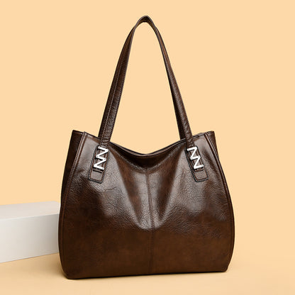 Bolso de mano retro-chic, de lujo sutil y gran capacidad.