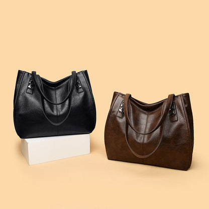 Bolso de mano retro-chic, de lujo sutil y gran capacidad.
