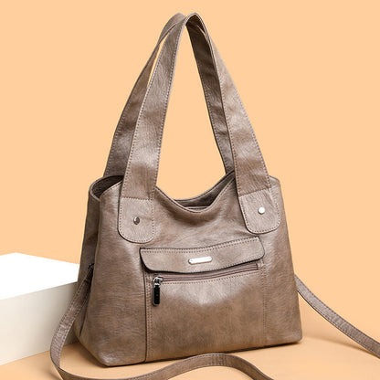 Bolso de cuero de gran capacidad y banda ancha