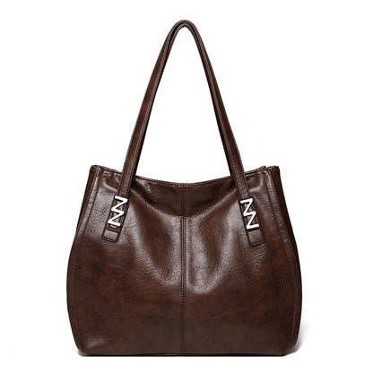 Bolso de mano retro-chic, de lujo sutil y gran capacidad.