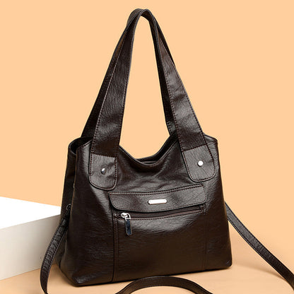 Bolso de cuero de gran capacidad y banda ancha