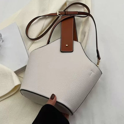 Un bolso de mano de cuero artificial elegante y multifuncional con una correa de hombro ajustable y portátil