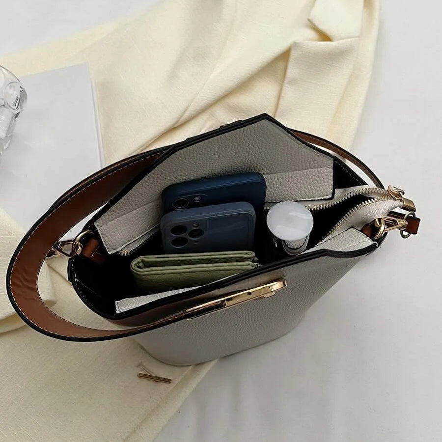 Un bolso de mano de cuero artificial elegante y multifuncional con una correa de hombro ajustable y portátil