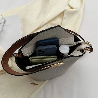 Un bolso de mano de cuero artificial elegante y multifuncional con una correa de hombro ajustable y portátil