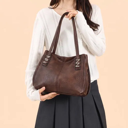 Bolso de mano retro-chic, de lujo sutil y gran capacidad.